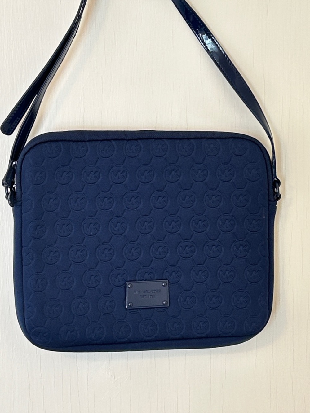 Michael Kors Navy Logo-Embossed bag.